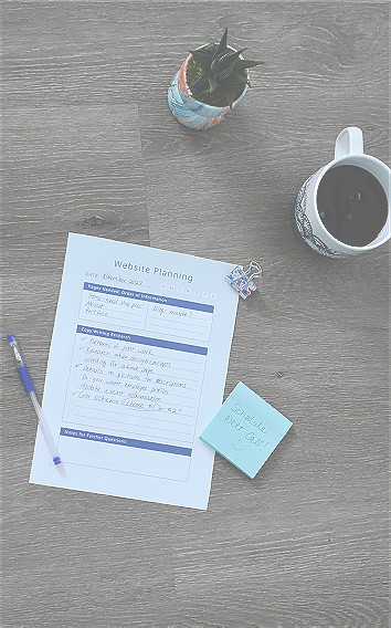 A checklist of things to get done on your new website or funnel with a plant, cup of coffee, pen and notepad